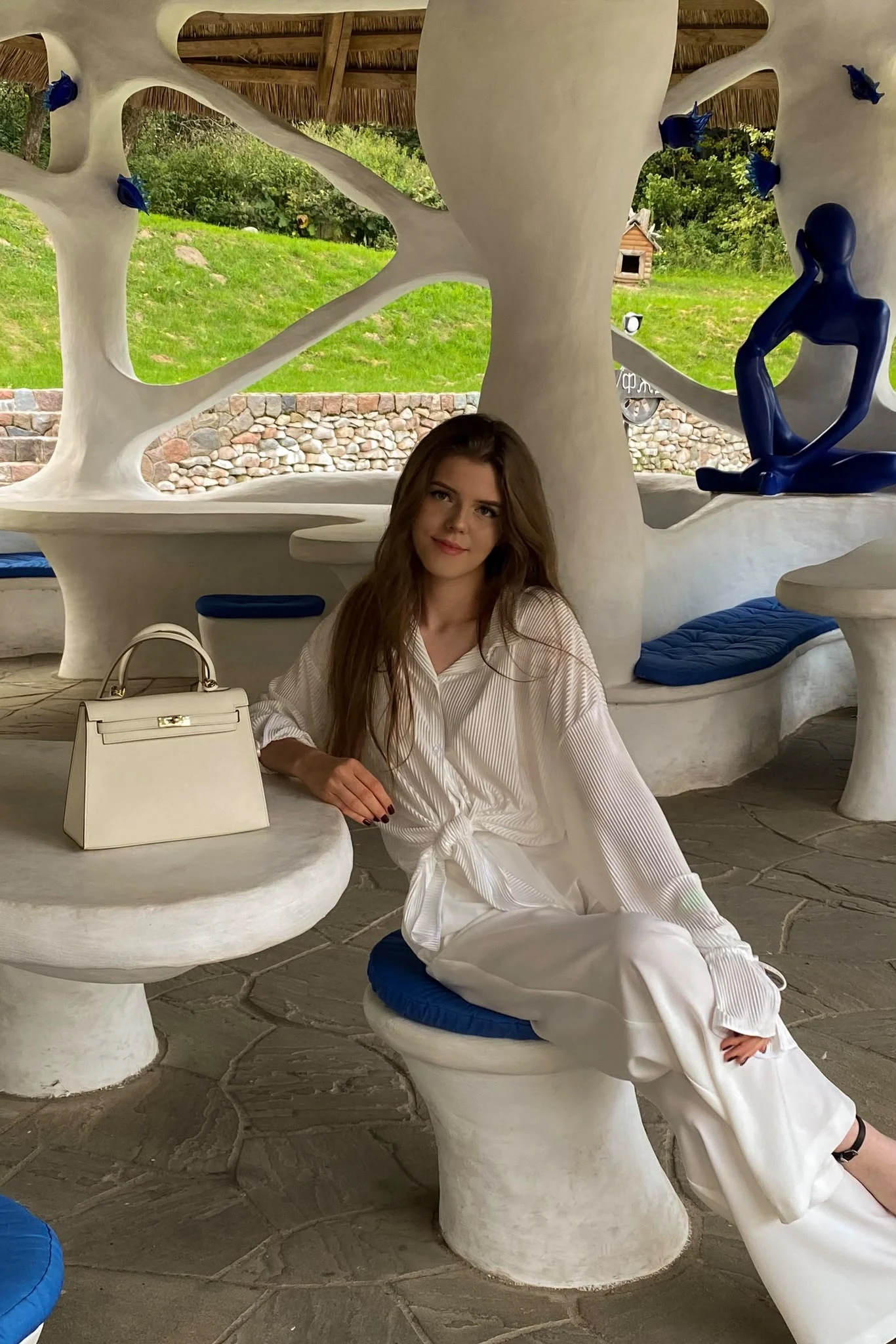 Kseniya Savitskaya in a white lounge setting
